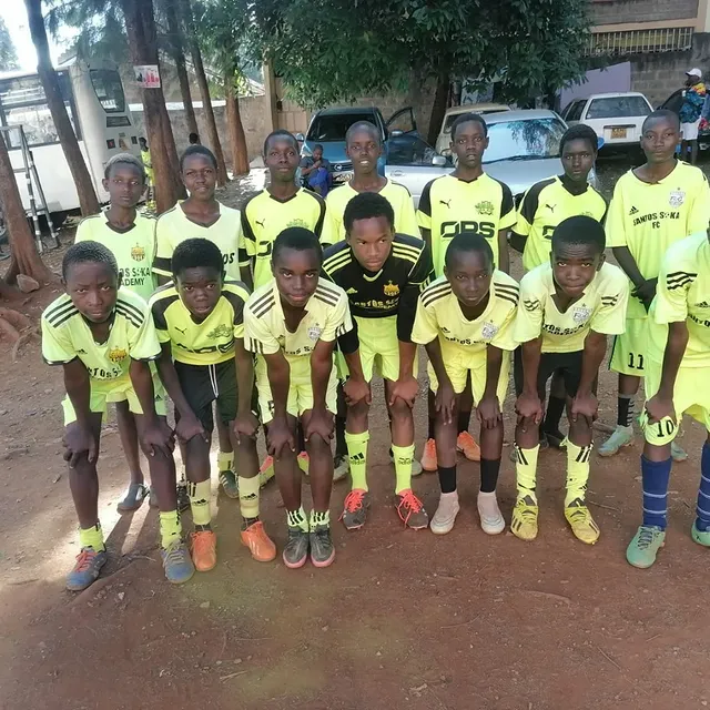 Santos Soka Academy — Squad celebration with trophy and medals