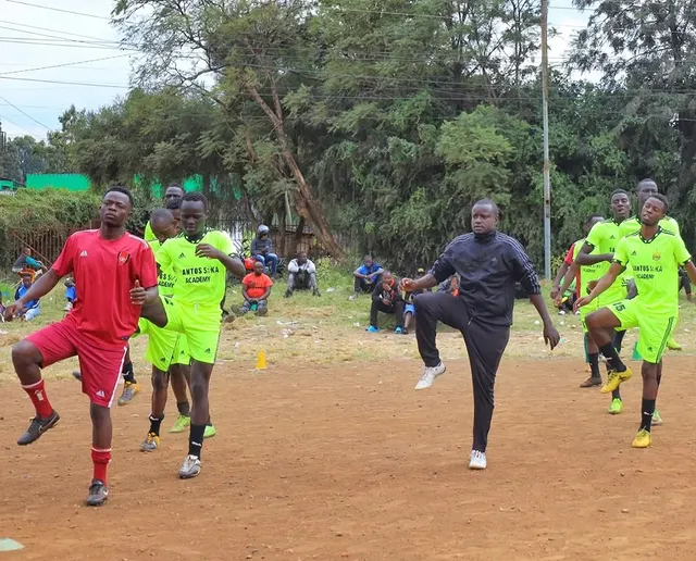 Santos Soka Academy — Coach leads the youth side on the pitch