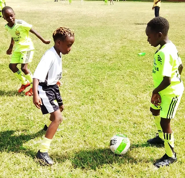 Young Santos Soka players working through a small-sided football drill